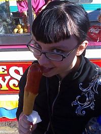 People & Humanity: girl eating hot dog