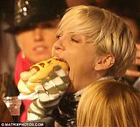 People & Humanity: girl eating hot dog