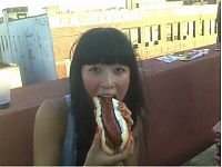 People & Humanity: girl eating hot dog