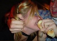 People & Humanity: girl eating hot dog