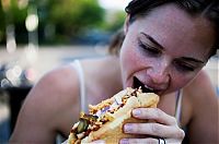 People & Humanity: girl eating hot dog