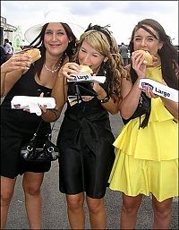 People & Humanity: girl eating hot dog