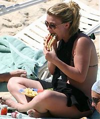 People & Humanity: girl eating hot dog