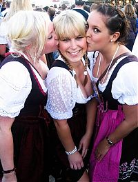 People & Humanity: Oktoberfest girls kissing, Munich, Bavaria, Germany
