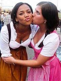 People & Humanity: Oktoberfest girls kissing, Munich, Bavaria, Germany