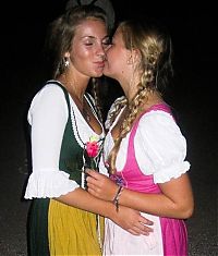 People & Humanity: Oktoberfest girls kissing, Munich, Bavaria, Germany