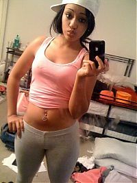 TopRq.com search results: young teen girl taking pictures in a mirror with iphone