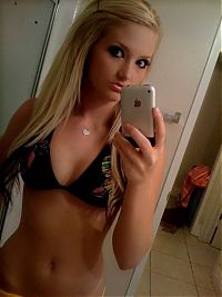 TopRq.com search results: young teen girl taking pictures in a mirror with iphone