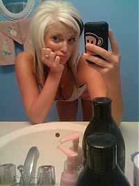 TopRq.com search results: young teen girl taking pictures in a mirror with iphone