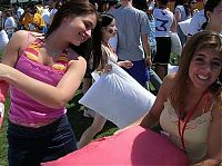 People & Humanity: girls fighting with pillows