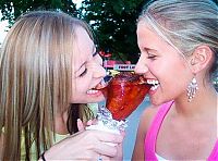 People & Humanity: girls eating a turkey leg