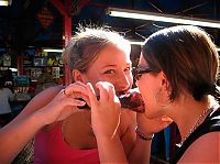 People & Humanity: girls eating a turkey leg