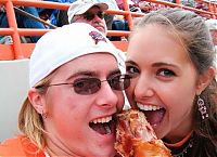 People & Humanity: girls eating a turkey leg