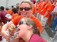 People & Humanity: girls eating a turkey leg