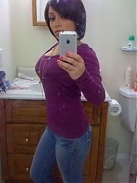 People & Humanity: young teen girl taking pictures in a mirror with iphone