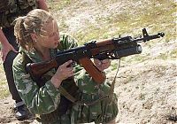 People & Humanity: girl with a gun