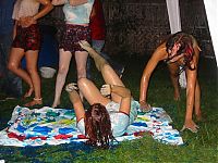 People & Humanity: party girls playing twister game