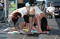 People & Humanity: party girls playing twister game