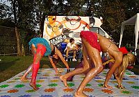 People & Humanity: party girls playing twister game