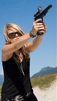 People & Humanity: girl with a gun