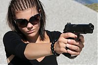 People & Humanity: girl with a gun