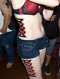 TopRq.com search results: girl with a corset piercing and extreme body modifications