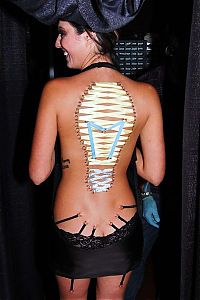 TopRq.com search results: girl with a corset piercing and extreme body modifications