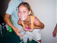 People & Humanity: young girls playing beer pong