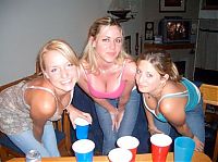 People & Humanity: young girls playing beer pong