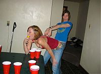 People & Humanity: young girls playing beer pong