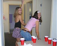 People & Humanity: young girls playing beer pong