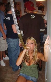 People & Humanity: young girl with a beer bong