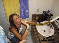 People & Humanity: young girl with a beer bong