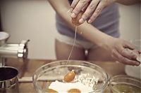 People & Humanity: young girl making cookies in the kitchen