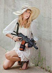 People & Humanity: girl with a gun