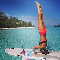 People & Humanity: paddle board yoga surfing girl