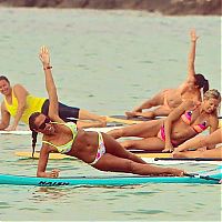 People & Humanity: paddle board yoga surfing girl