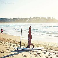 People & Humanity: paddle board yoga surfing girl