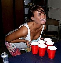 People & Humanity: young girls playing beer pong