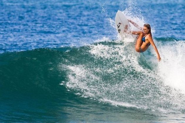 young surfing girl