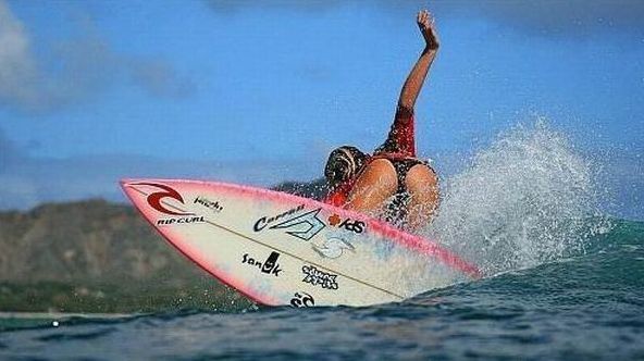 young surfing girl
