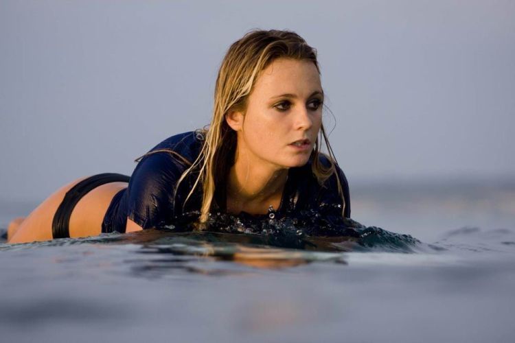 young surfing girl