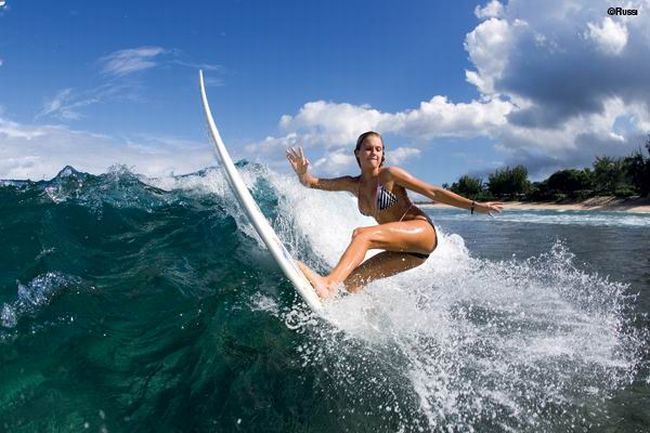 young surfing girl