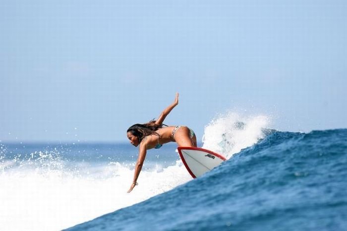 young surfing girl