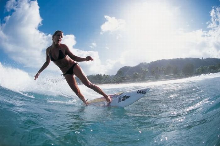 young surfing girl