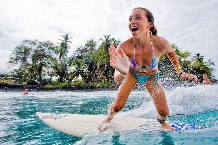 young surfing girl