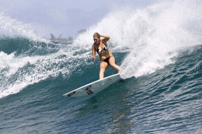 young surfing girl