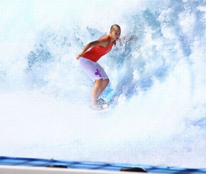 young surfing girl