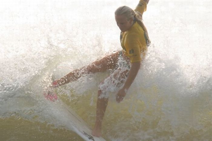 young surfing girl