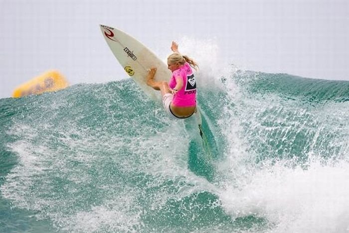 young surfing girl